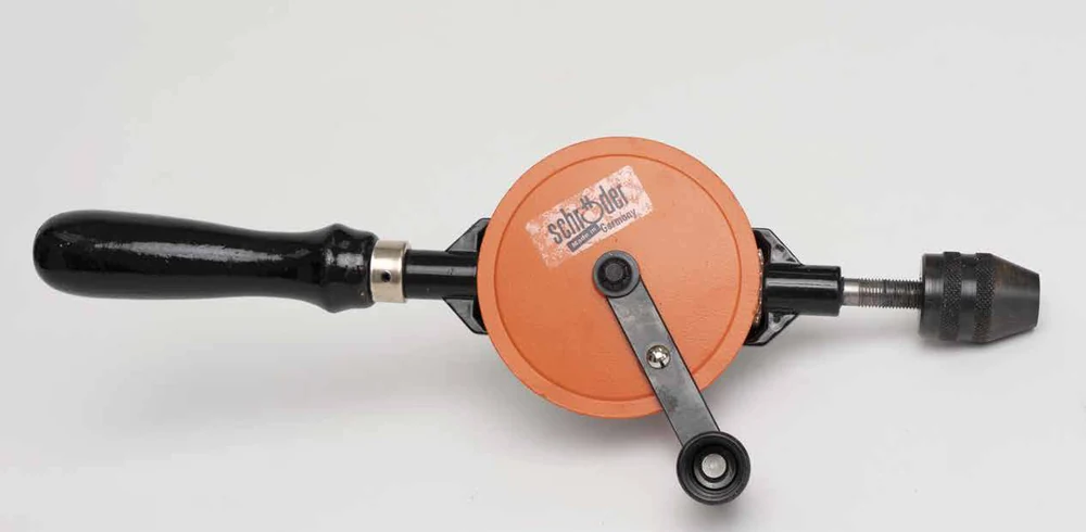 Maplewoodshop photograph of a geared hand drill with a main handle, side crank, and chuck.