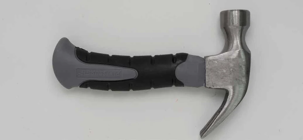 Maplewoodshop photograph of a claw hammer with a flat striking face and curved nail-removal claw.